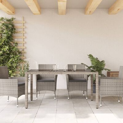 vidaXL Table de jardin dessus en verre Gris 150x90x75cm Résine tressée