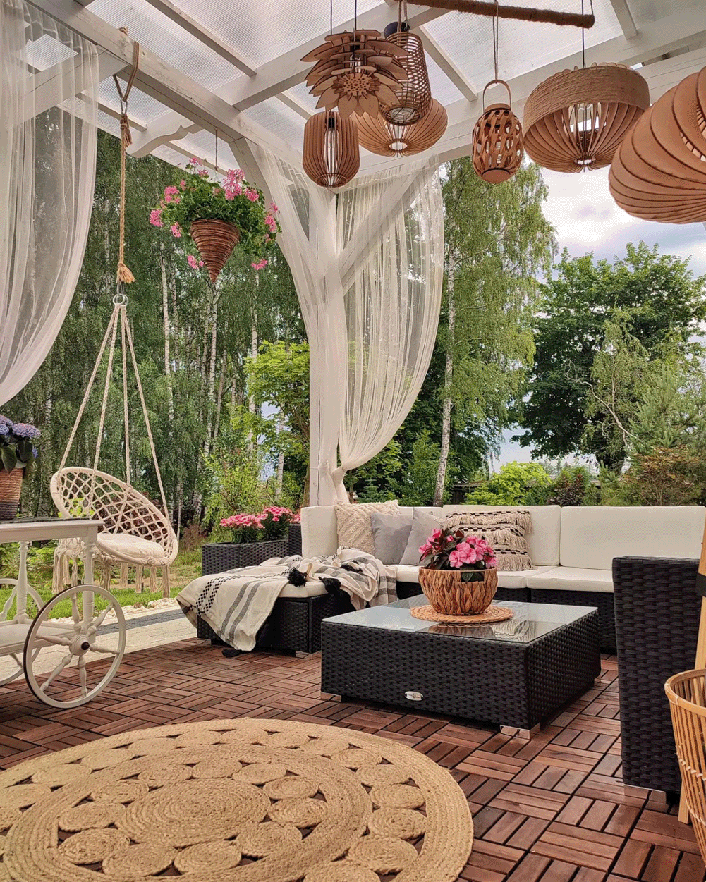 Bohemian patio with hanging lights and curtains