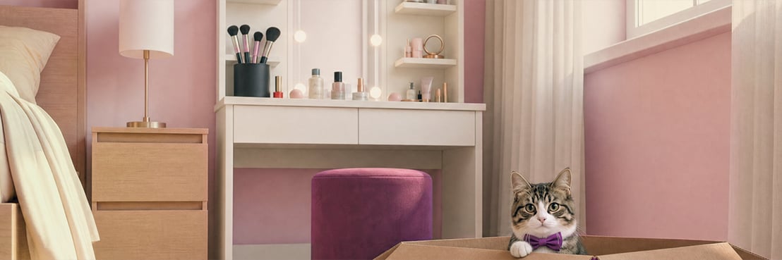 Chat qui regarde depuis une boîte vidaXL dans une chambre avec une coiffeuse et des tiroirs de rangement.